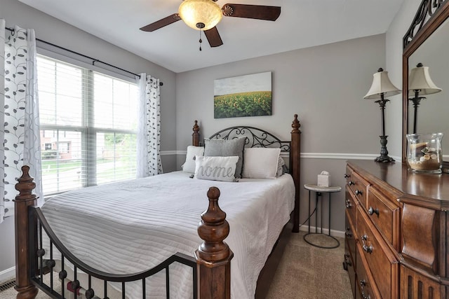 bedroom featuring baseboards, ceiling fan, and carpet floors
