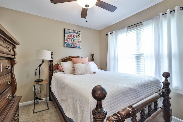 carpeted bedroom with baseboards and ceiling fan