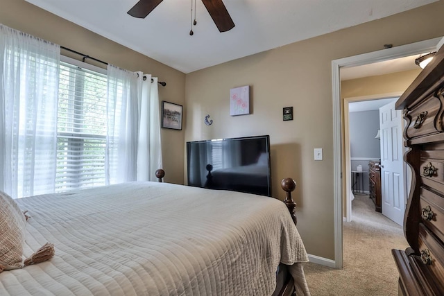 bedroom featuring carpet floors, baseboards, and a ceiling fan