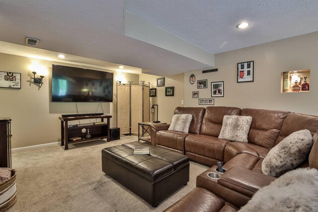 carpeted living area featuring baseboards, recessed lighting, a textured ceiling, and visible vents