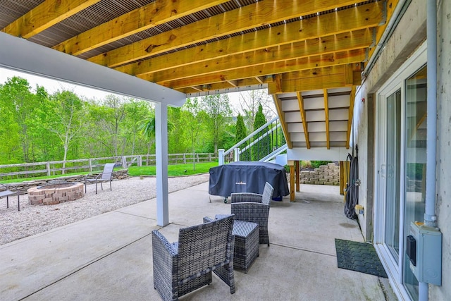 view of patio featuring area for grilling, a fire pit, and a fenced backyard