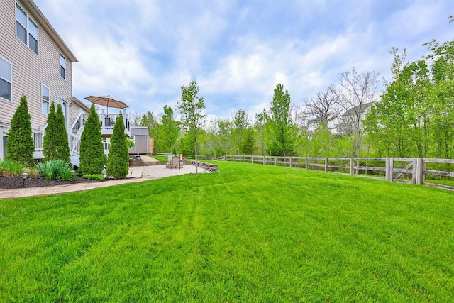 view of yard with a fenced backyard and a patio area