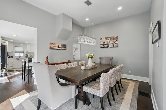 dining area with recessed lighting, wood finished floors, visible vents, and baseboards