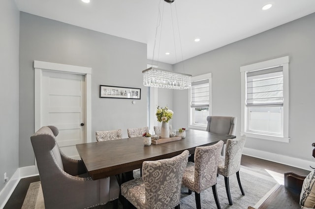 dining area featuring baseboards, a chandelier, wood finished floors, and recessed lighting