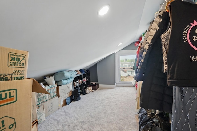 additional living space with lofted ceiling and carpet floors