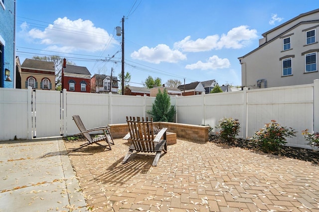 view of patio / terrace with a fenced backyard and a gate