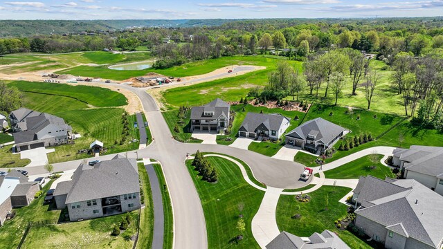drone / aerial view featuring a residential view and a water view