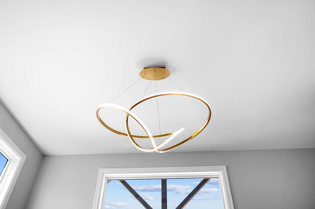 interior details featuring an inviting chandelier