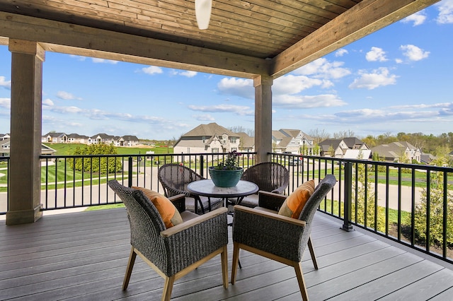 wooden terrace featuring a residential view