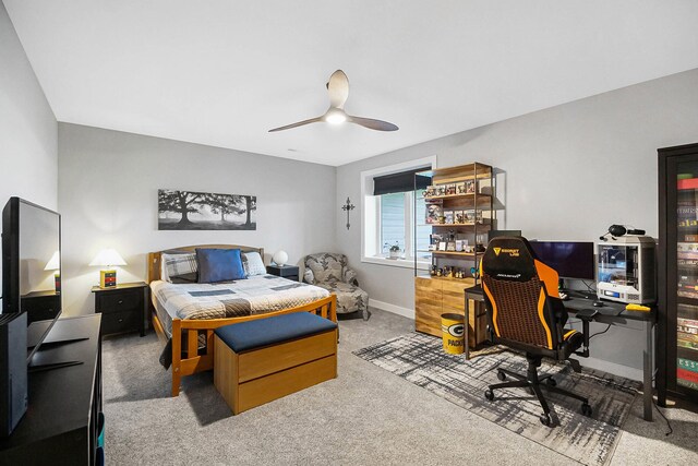 bedroom featuring baseboards, carpet, and ceiling fan