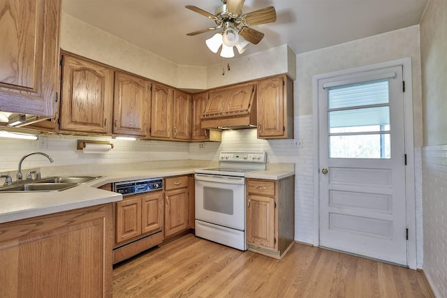kitchen featuring white electric range oven, a sink, light countertops, paneled dishwasher, and custom exhaust hood