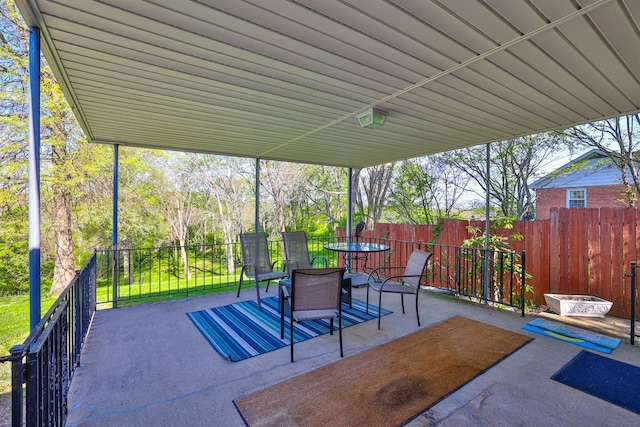 view of patio / terrace featuring fence and outdoor dining area