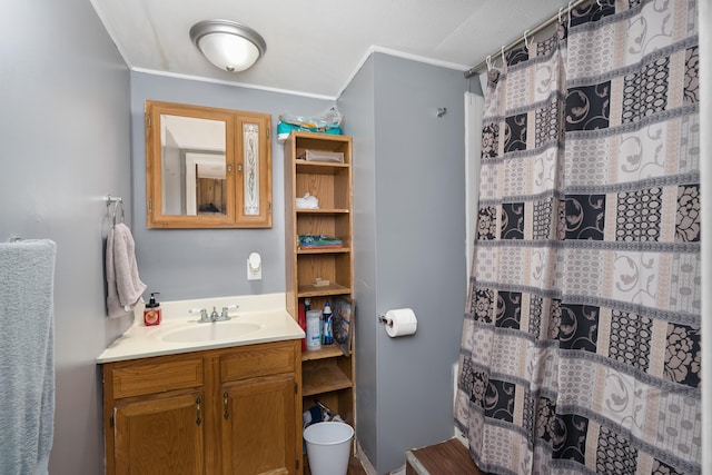 bathroom featuring vanity and a shower with shower curtain