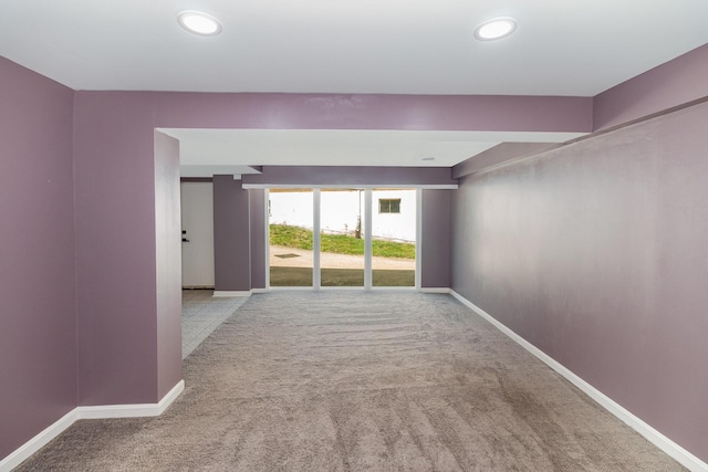 unfurnished room with carpet floors, baseboards, and recessed lighting