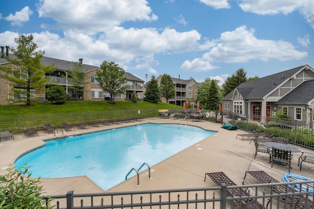 community pool featuring a patio area