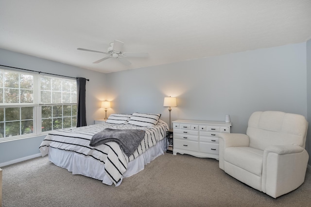 bedroom featuring carpet, baseboards, and ceiling fan