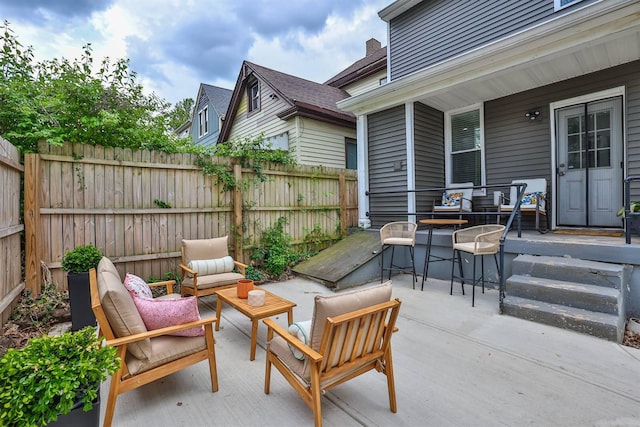 view of patio / terrace featuring fence and an outdoor living space