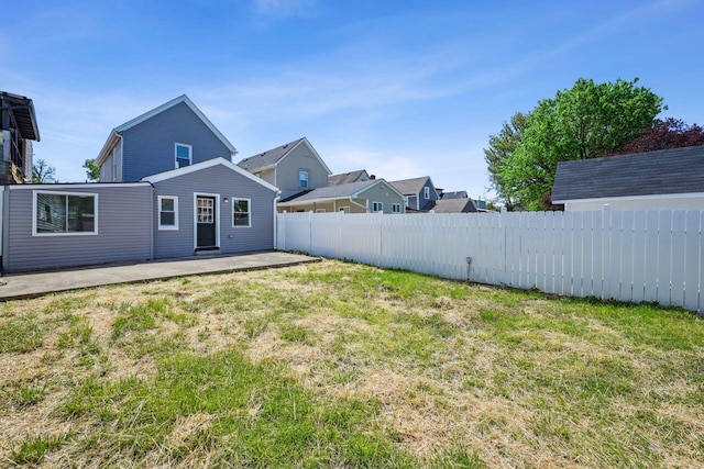 view of yard featuring a patio area and fence