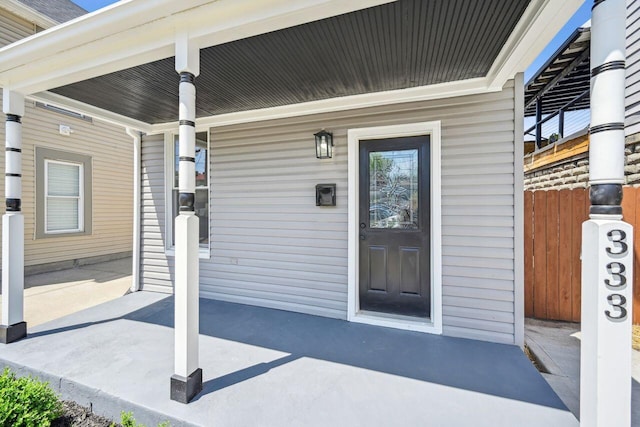 entrance to property featuring a porch