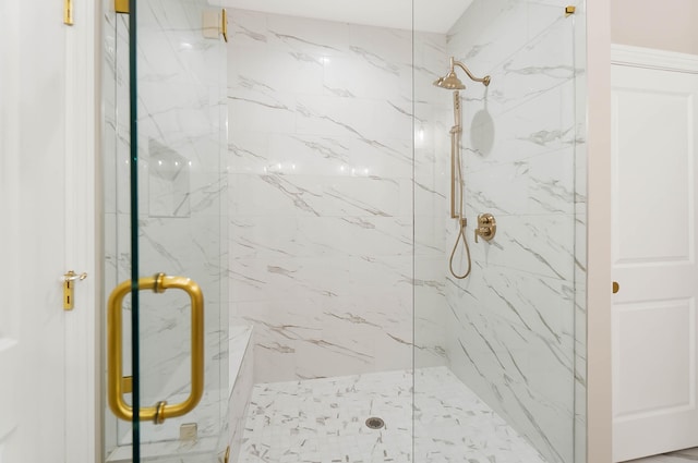 full bath featuring a marble finish shower