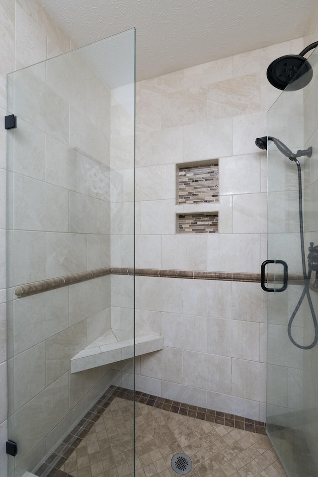 bathroom with a shower stall