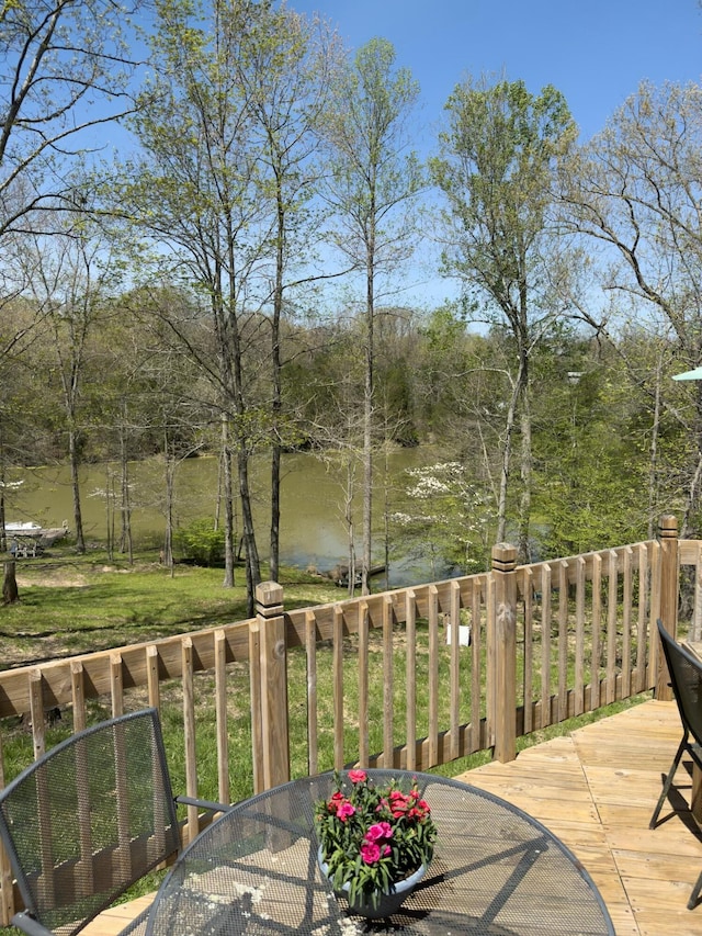 wooden terrace with outdoor dining area