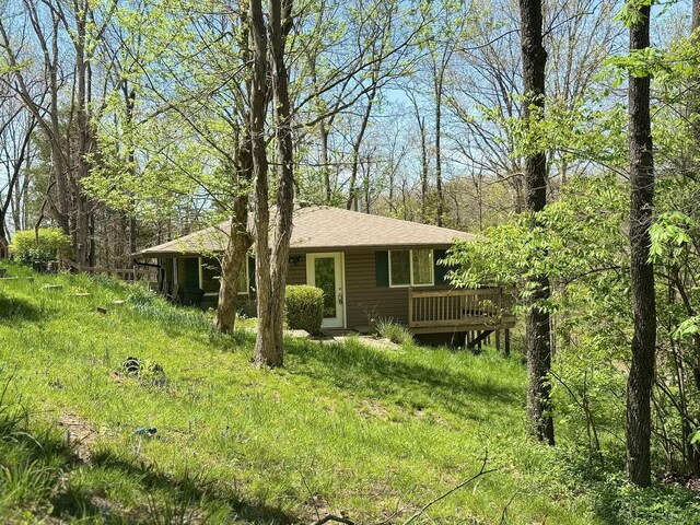 exterior space featuring a wooden deck