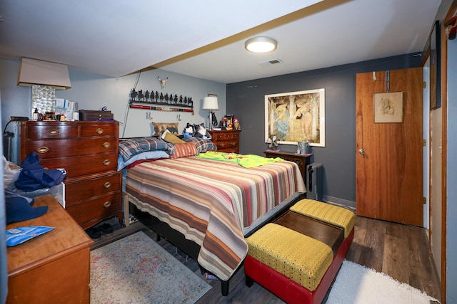 48 Bonnie Ln, Fort Thomas, KY 41075 - bedroom with baseboards, visible vents, radiator, and wood finished floors