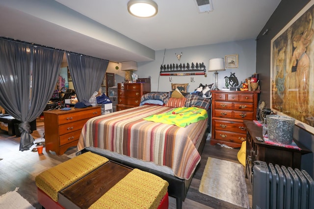 48 Bonnie Ln, Fort Thomas, KY 41075 - bedroom featuring radiator, visible vents, and wood finished floors