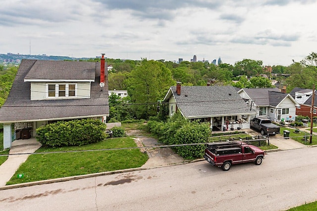 bungalow-style home featuring a chimney