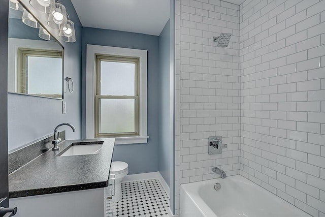 full bath with tile patterned floors, plenty of natural light, shower / bathtub combination, and toilet