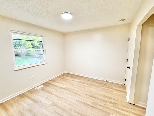 4216 Arbor Ct, Independence, KY 41051 - spare room featuring baseboards, light wood finished floors, a textured ceiling, and visible vents