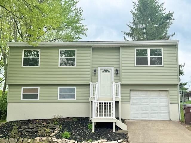 4216 Arbor Ct, Independence, KY 41051 - bi-level home featuring concrete driveway and a garage
