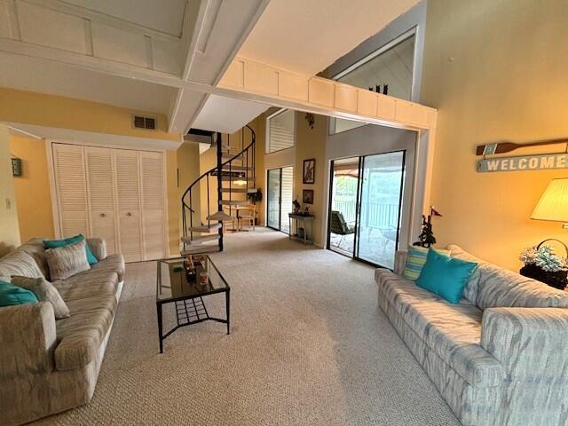 40 Fairway Ct Unit 14, Perry Park, KY 40363 - living room featuring beamed ceiling, stairway, coffered ceiling, visible vents, and carpet