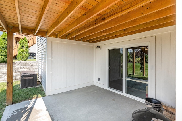 view of patio with fence and central AC unit
