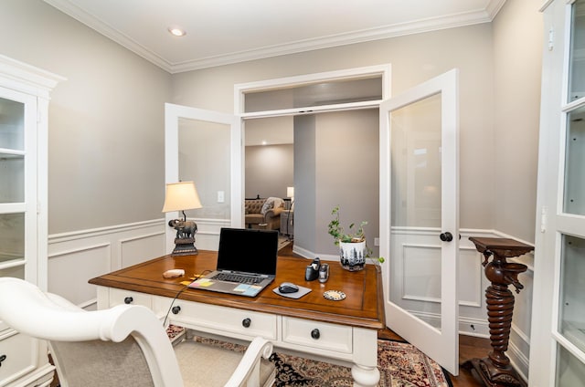 office area featuring a decorative wall, crown molding, wainscoting, and french doors