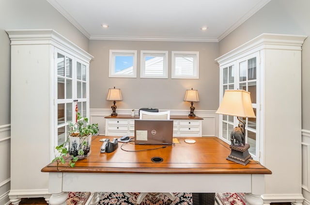 office featuring ornamental molding and a wainscoted wall