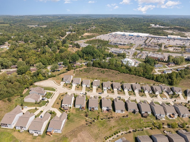 birds eye view of property with a residential view