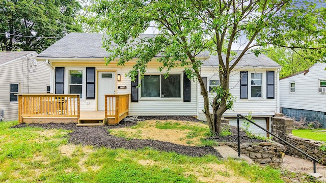 510 Fox St, Elsmere, KY 41018 - view of front facade with a deck, a garage, and roof with shingles
