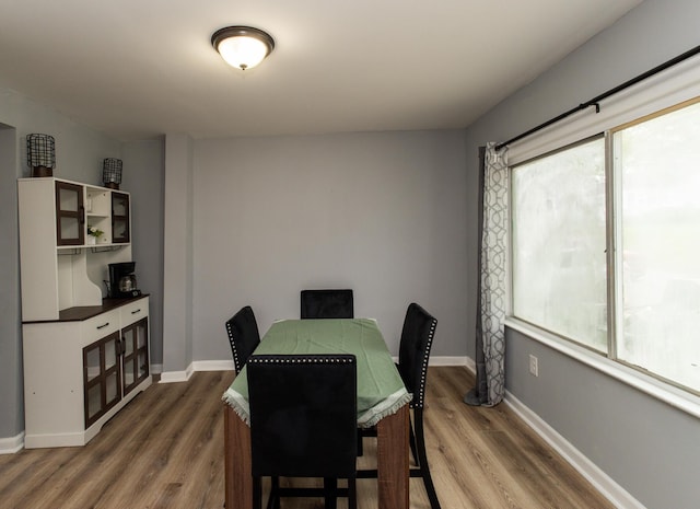 510 Fox St, Elsmere, KY 41018 - dining space featuring healthy amount of natural light, wood finished floors, and baseboards