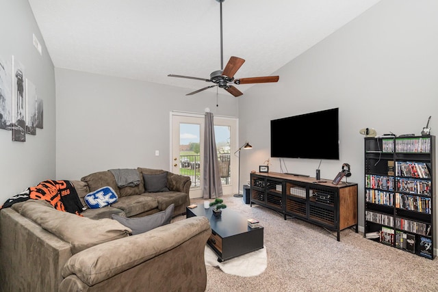 carpeted living room featuring a ceiling fan and lofted ceiling