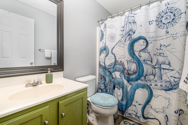 bathroom featuring vanity, a textured ceiling, curtained shower, and toilet