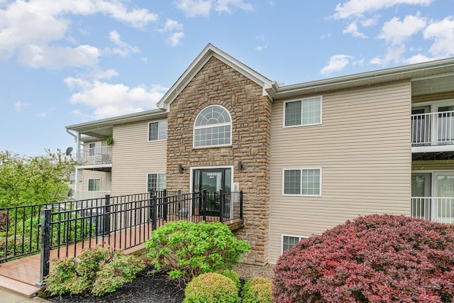 exterior space featuring stone siding