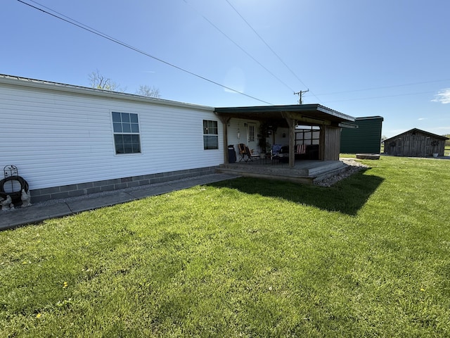 rear view of house with a lawn