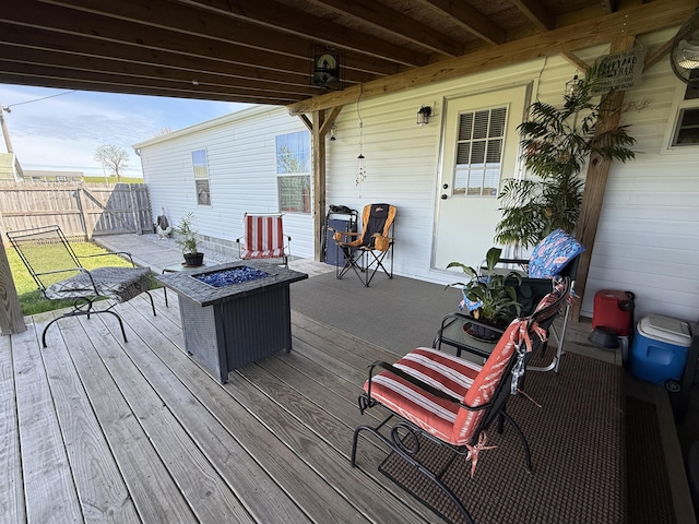 deck featuring fence and an outdoor fire pit