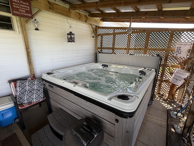 wooden terrace with a hot tub