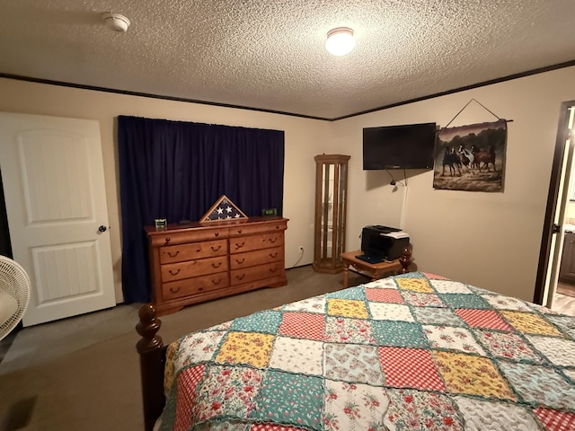 bedroom with a textured ceiling and carpet flooring