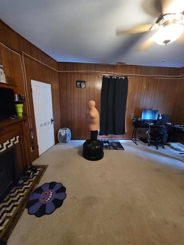 103 N Main St, Crittenden, KY 41030 - misc room with carpet floors, wooden walls, a ceiling fan, and a desk