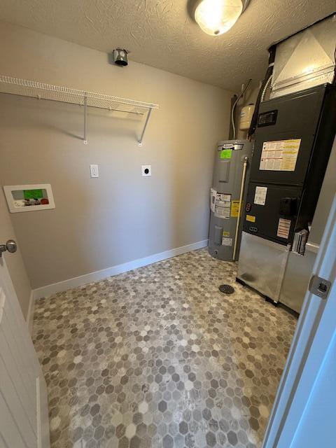utility room featuring electric water heater