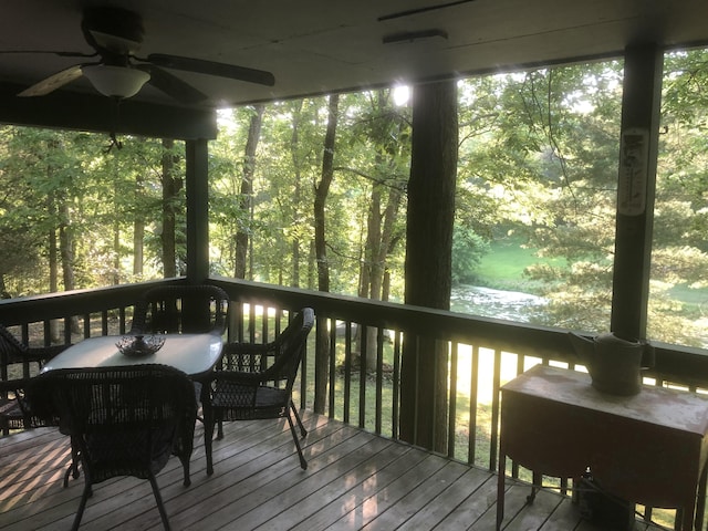 wooden terrace with a ceiling fan